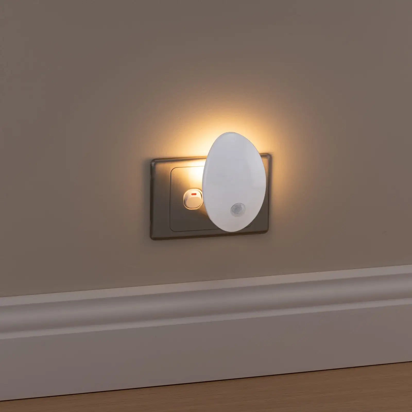 Arlec plug-in LED night light with motion sensor and warm white glow for bedrooms