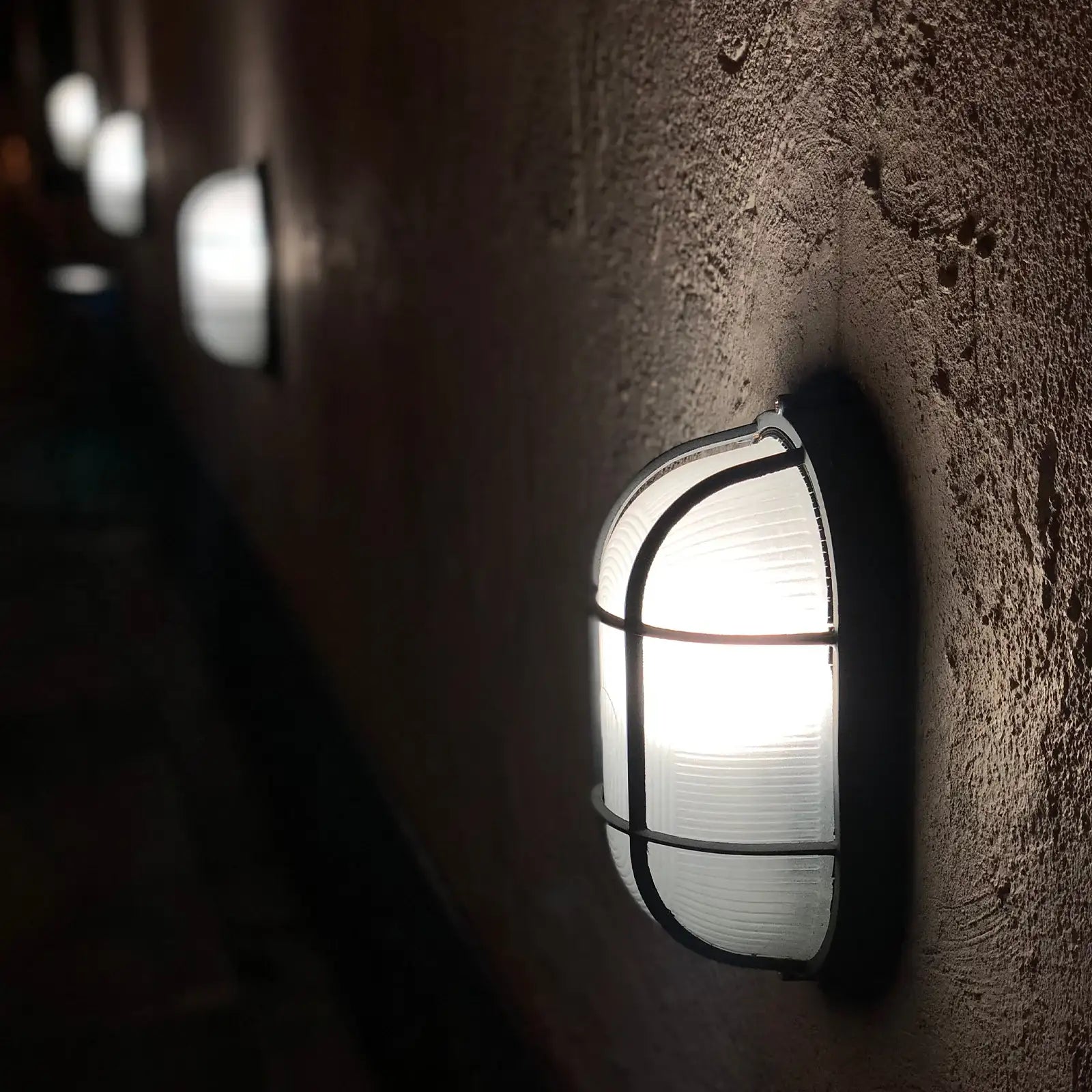 Arlec Black Oval Caged Bunker Light - bunker wall light
