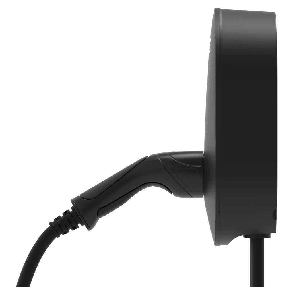 Side view of a black EV charging station with an attached charging cable